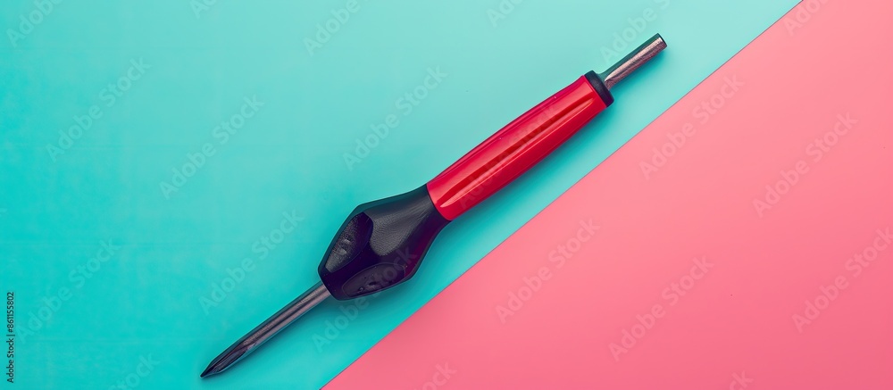 Red and black handled Phillips screwdriver on pastel background. Copy space image. Place for adding text and design Red and black handled Phillips screwdriver on pastel background. Copy space image. Place for adding text and design