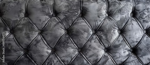 Grey velour background with quilted upholstery in Chesterfield style close-up. Copy space image. Place for adding text and design photo