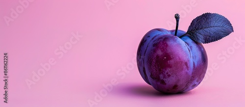 a plum with a USBport, the evolution of the fruit pastel background. Copy space image. Place for adding text and design photo