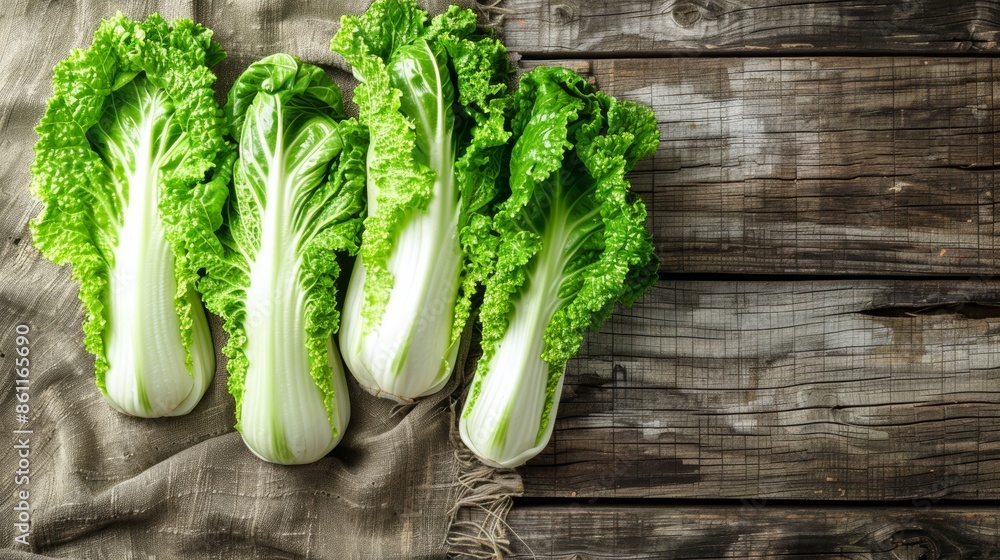 Fresh chinese cabbage on wooden surface top view of healthy vegetable on bleached board Fresh chinese cabbage on wooden surface top view of healthy vegetable on bleached board