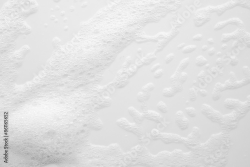 Abstract white soap foam bubbles texture on white background © Piman Khrutmuang