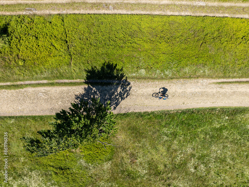 Drone fly above green mountains in summer and mountain biking. Drone view on Beskid mountains, Mountain biking in the mountains. Summer green forest on Blatnia. Beskid mountains in Jaworze. photo