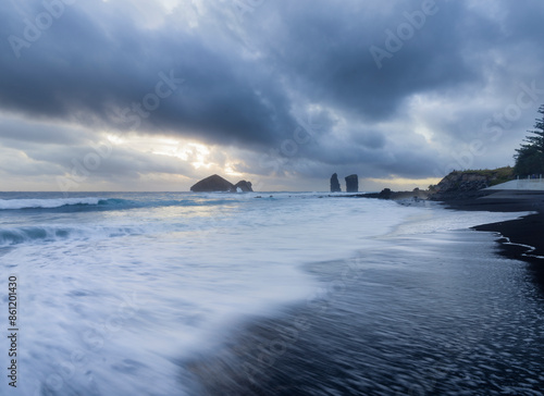 A scenic beach of Mosteiros in Azores Island featuring sea stacks scattered amidst the water.
 photo