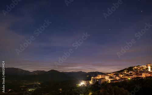 Night time over the town of Sartene in southern Corsica with the Bavella mountains in the distance