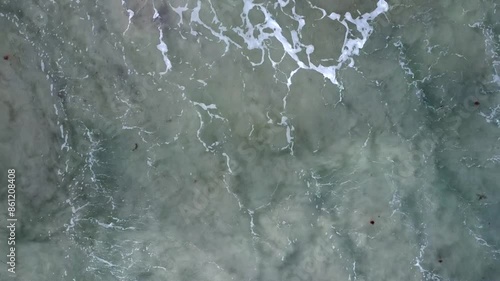 Aerial closeup of surf over sand on Cottesloe Beach, Perth, Western Australia photo