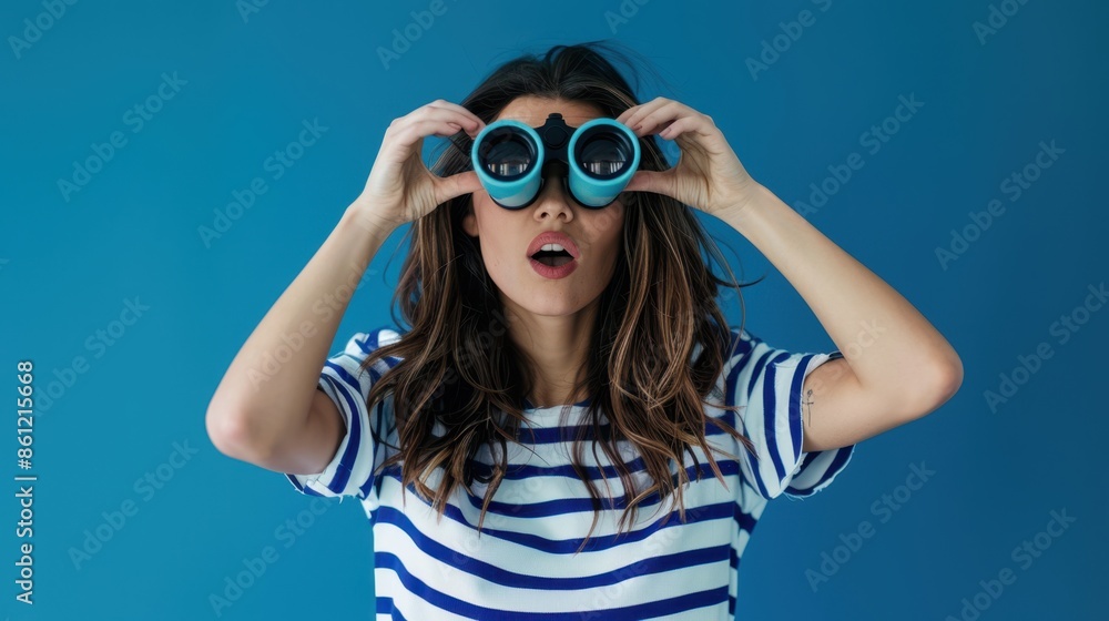 woman looking through binoculars woman looking through binoculars