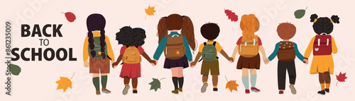 Children go to school holding hands. Back to school concept. 