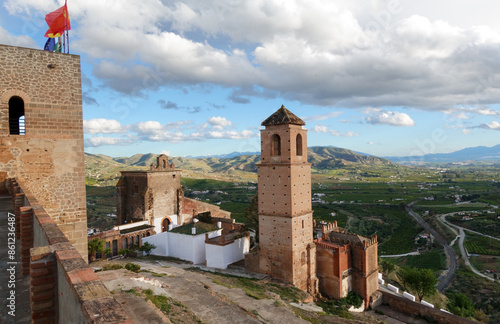 Alora castle overlooking the green Guadalhorce valley in spring.  photo