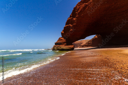 Spectacular natural red arch on atlantic ocean coast. Legzira ( or Lagzira, or Gzira) beach. Sidi Ifni, Morocco, Africa photo