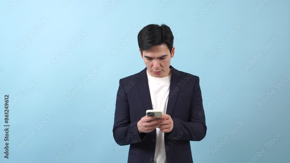 Young Asian businessman on blue background Young Asian businessman on blue background