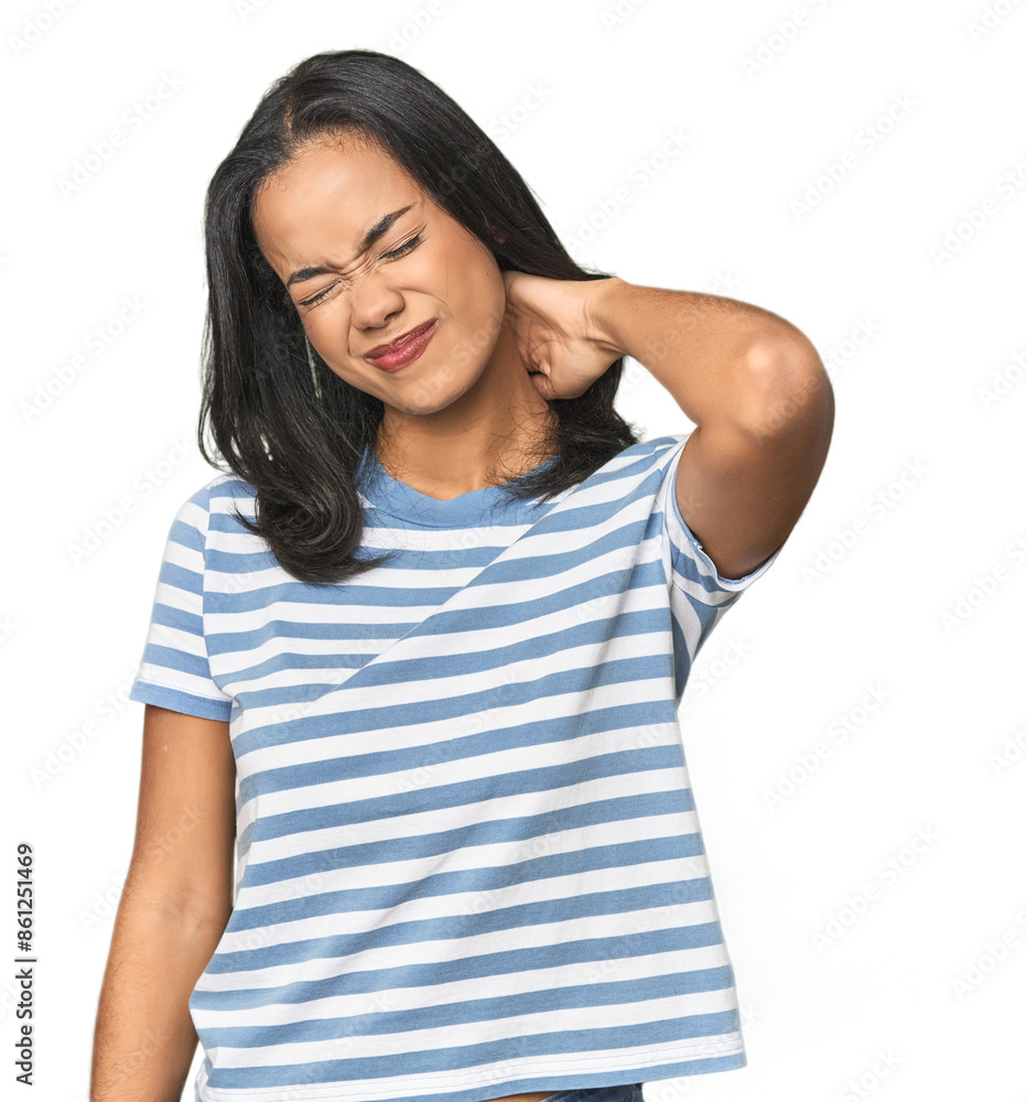 Young Latina posing in studio suffering neck pain due to sedentary lifestyle. Young Latina posing in studio suffering neck pain due to sedentary lifestyle.
