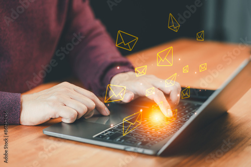 Technology and lifestyle concepts, Email Marketing and Newsletters. Male hand using computer laptop and sending online message with email icon.