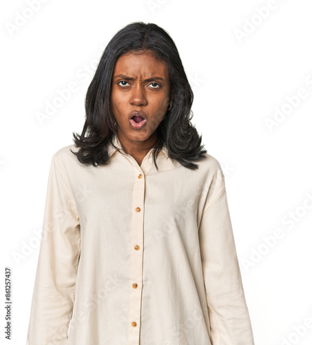 Portrait of a young Indian woman shouting very angry, rage concept, frustrated.