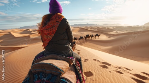 The woman riding camel photo