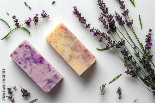 Handmade soap bars and lavender on white background, top view