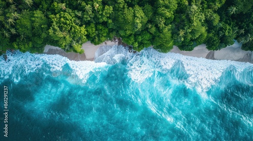 Aerial view of blue ocean waves along the beautiful natural beach of the Andaman Sea. Southern Thailand