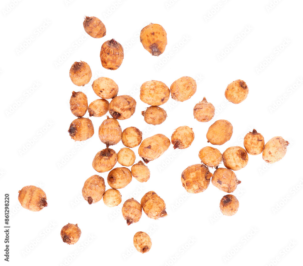 Tiger nuts isolated on white background. Pile of chufa nuts, earth almond or chufa sedge. Cyperus esculentus. Top view. Tiger nuts isolated on white background. Pile of chufa nuts, earth almond or chufa sedge. Cyperus esculentus. Top view.