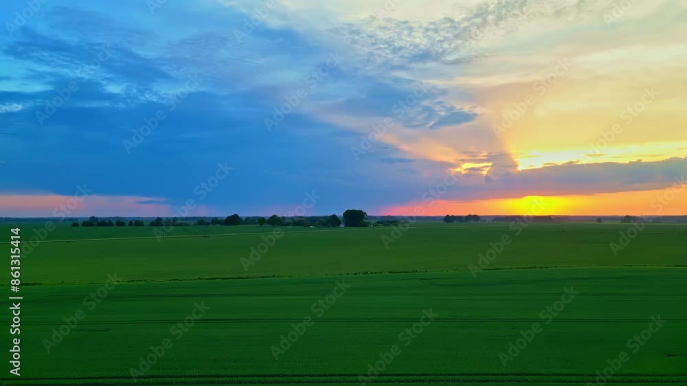Green field at sunset golden hour, beautiful sky, Aerial slow drone nature Green field at sunset golden hour, beautiful sky, Aerial slow drone nature