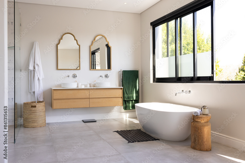 Modern bathroom with freestanding bathtub, double sink vanity, and large windows, copy space Modern bathroom with freestanding bathtub, double sink vanity, and large windows, copy space