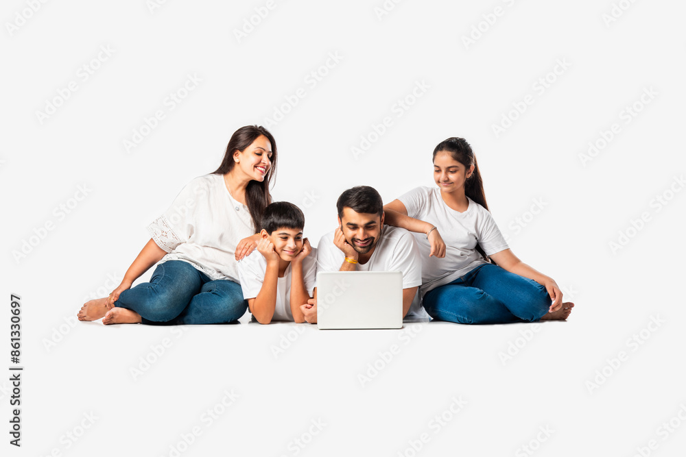 Indian asian young family with parents and kids using computer while sitting isolated on white