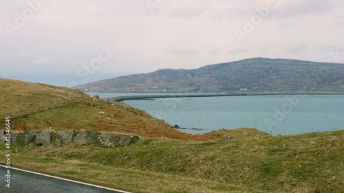 Ocean view overlooking Eriskay Causeway linking the isle of Eriskay with South Uist in the Outer Hebrides of Scotland UK photo