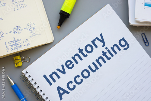 Document about inventory accounting and marks in the notepad.