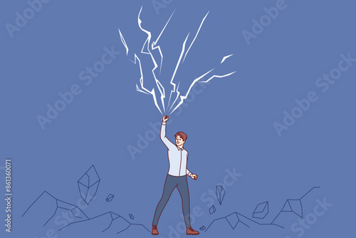 Powerful business man raises hand up near lightning bolts, demonstrating self-confidence and superpowers. Powerful entrepreneur is not afraid of natural anomalies and cataclysms that cause awe