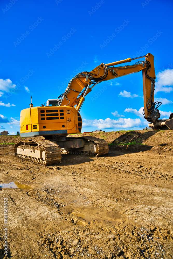 a new road is being built a modern excavator performs excavation work on the construction site a new road is being built a modern excavator performs excavation work on the construction site
