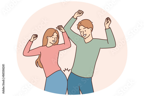 Smiling couple dance celebrate success
