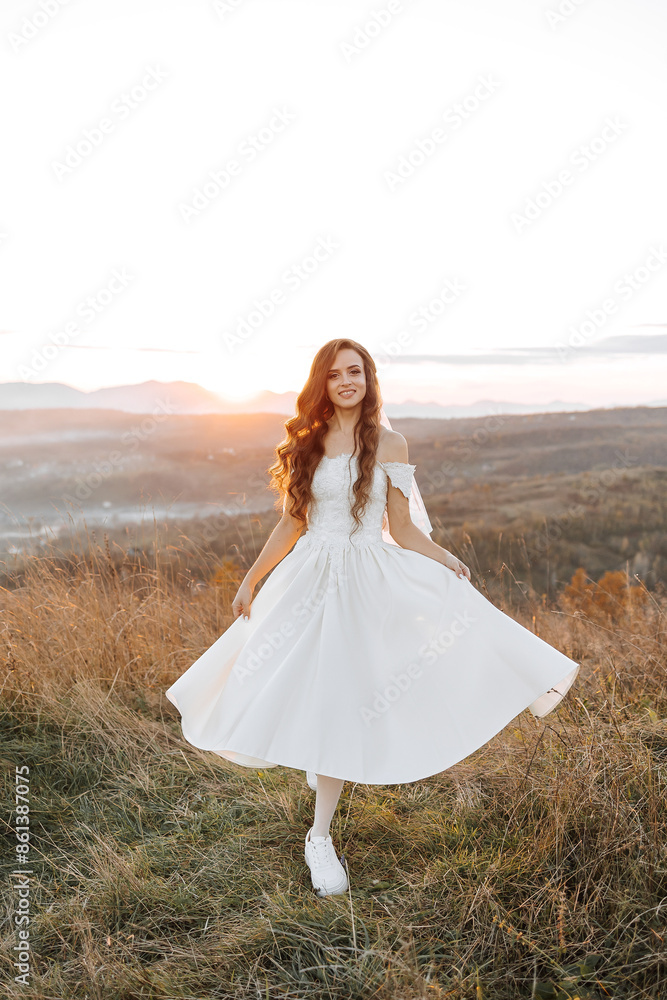 A woman in a white dress is standing on a grassy hillside, looking out at the horizon. The scene is serene and peaceful, with the sun setting in the background. The woman is enjoying the moment A woman in a white dress is standing on a grassy hillside, looking out at the horizon. The scene is serene and peaceful, with the sun setting in the background. The woman is enjoying the moment