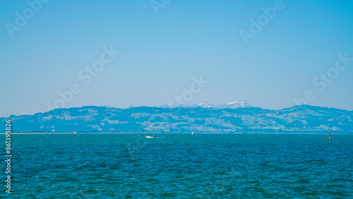 Obraz na płótnie Germany, Alps mountains nature landscape behind water of bodensee lake, panorama view from lindau to swiss coast and saentis mountain with snow w salonie