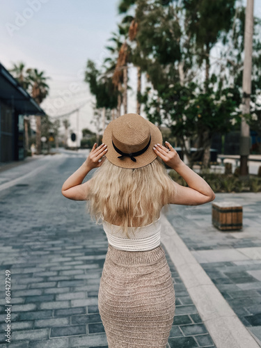 Obraz na płótnie Beautiful blonde girl on the atmospheric La Mer beach in Dubai, 2024 w salonie