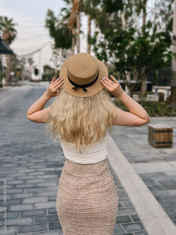 Beautiful blonde girl on the atmospheric La Mer beach in Dubai, 2024