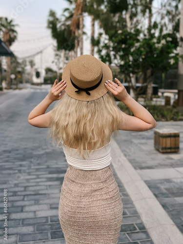 Obraz na płótnie Beautiful blonde girl on the atmospheric La Mer beach in Dubai, 2024 w salonie