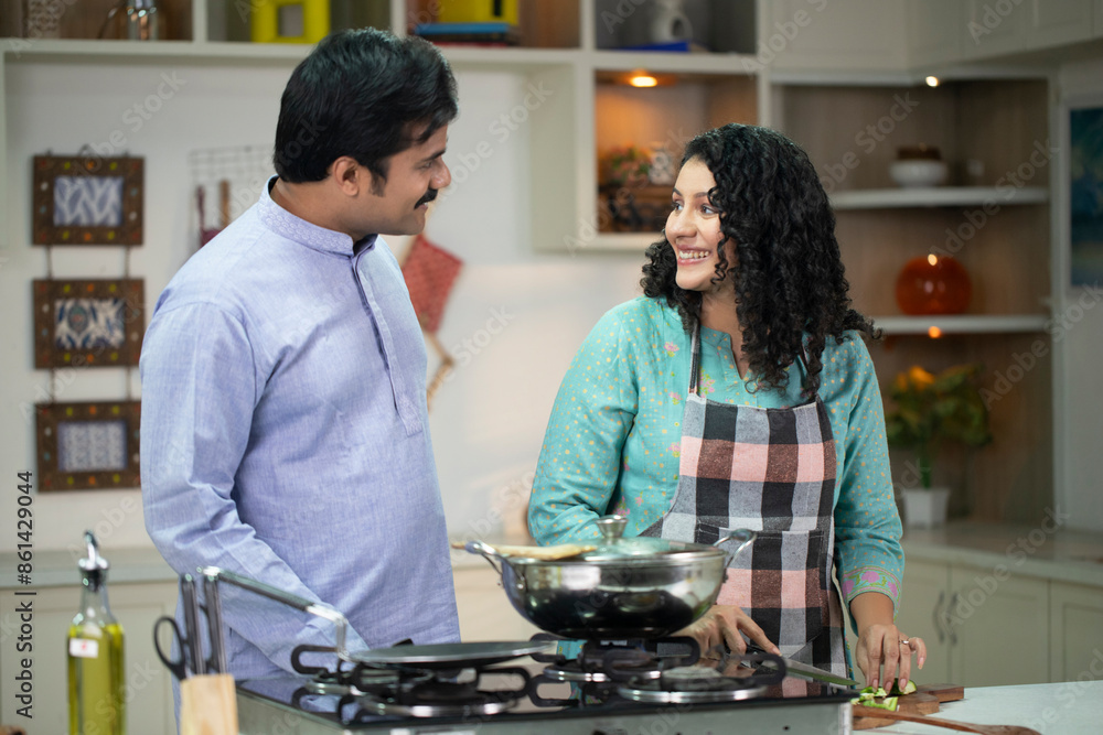 Indian Couple Cooking Together In Kitchen Indian Couple Cooking Together In Kitchen