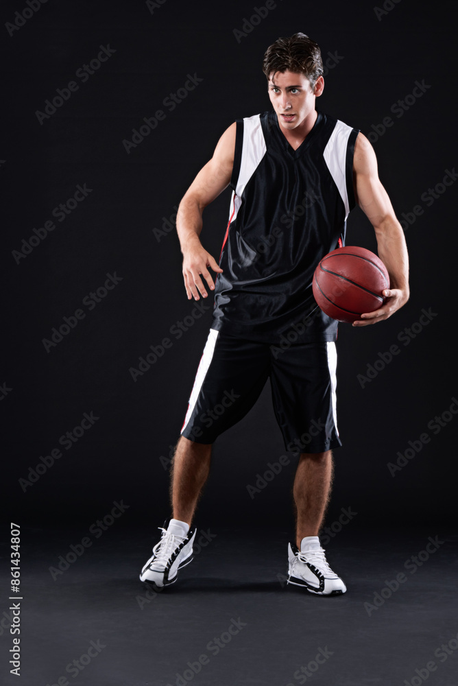 Sport, basketball player and man in studio with training, workout or practicing for game. Activity, career and male athlete with fitness equipment for match or exercise isolated by black background. Sport, basketball player and man in studio with training, workout or practicing for game. Activity, career and male athlete with fitness equipment for match or exercise isolated by black background.
