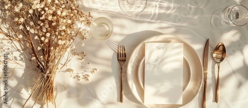 Festive table setting for a wedding or birthday with dry branches, card mockup for menu concept. Top view flat lay with copy space image.