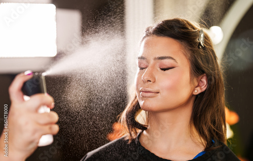 Fotografía Professional beautician applying makeup on beautiful young woman's face