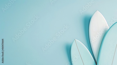 Closeup view of surfing boards over plain background