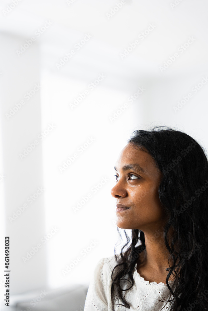Indian serious woman thinking with white copy space above. Indian serious woman thinking with white copy space above.