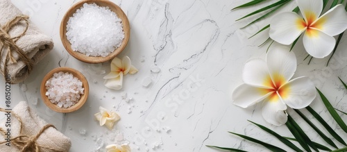 Wallpaper Mural A flat lay arrangement featuring spa bags, sea salt, and a plumeria flower on a white marble surface, with room for a copy space image. Torontodigital.ca