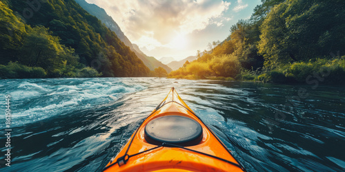 Fototapeta Naklejka Na Ścianę i Meble -  Kayaking down a mountain river at sunset