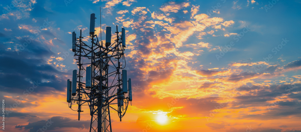 Tall telecommunication tower against sunset sky Tall telecommunication tower against sunset sky