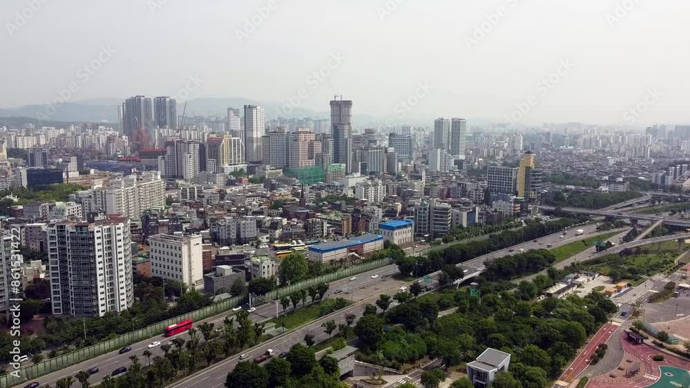 Korean metropolis Seoul, due to smoke, city skyline is barely visible, expressway limited by bridges with car and bus traffic, city pollution and gas pollution concept Korean metropolis Seoul, due to smoke, city skyline is barely visible, expressway limited by bridges with car and bus traffic, city pollution and gas pollution concept