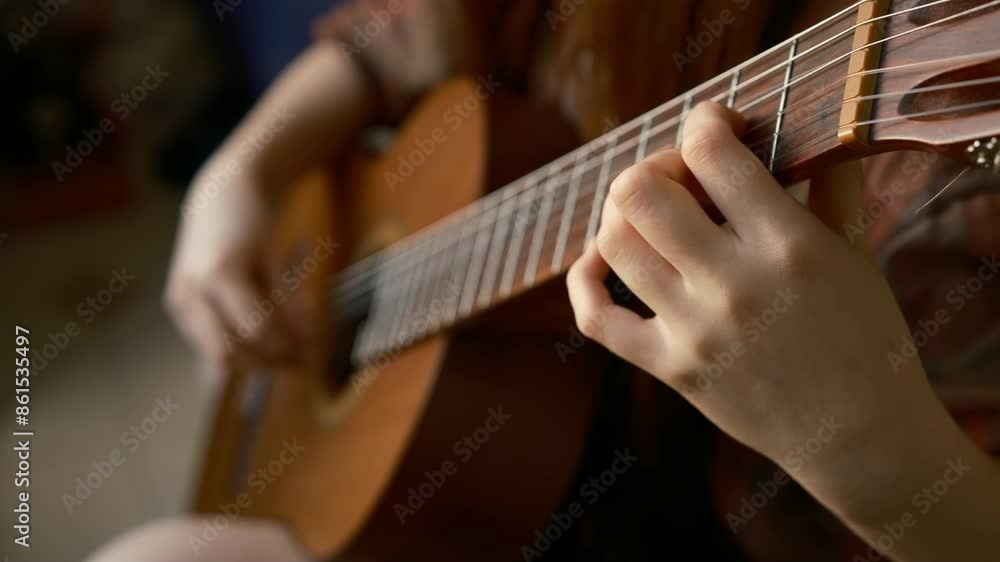 Teenager girl plays classical guitar close-up detail, fingers plucking the strings. play at home. does housework. home music training, cinematic.