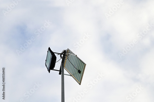 Mini Solar cell is standing outside to collect sunlight and change to be electric at night clean energy to save world.