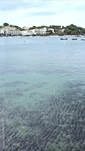 High-definition vertical video footage of the picturesque white villas and crystal-clear waters of Cadaqués, a charming town located in the Costa Brava region of Spain