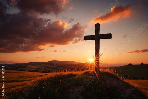 Sunset behind cross in Easter landscape 