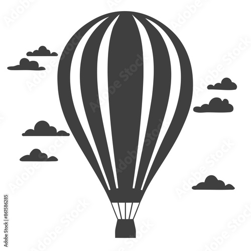 A black and white hot air balloon floating in the sky with clouds