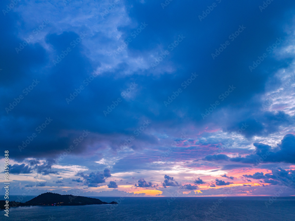 Obraz premium light pink cloud in the dark blue sunset.Unconventional and beautiful natural views of the sea..Nature video High quality footage..Unique and creative travel and nature idea